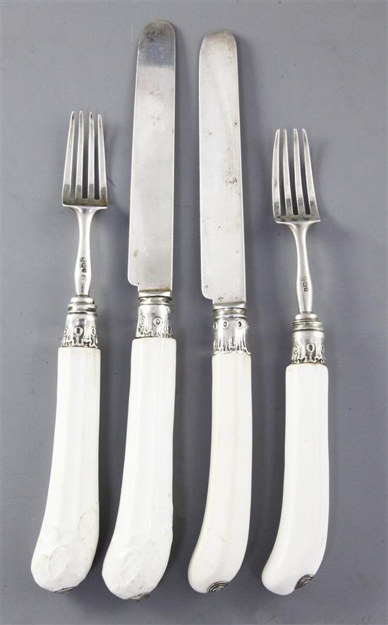 Two pairs of white soft paste porcelain handled knives and forks, possibly French mid 18th century, 18 - 22.5cm